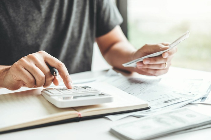Man working out income