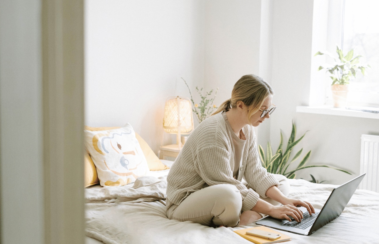 Woman working on bed