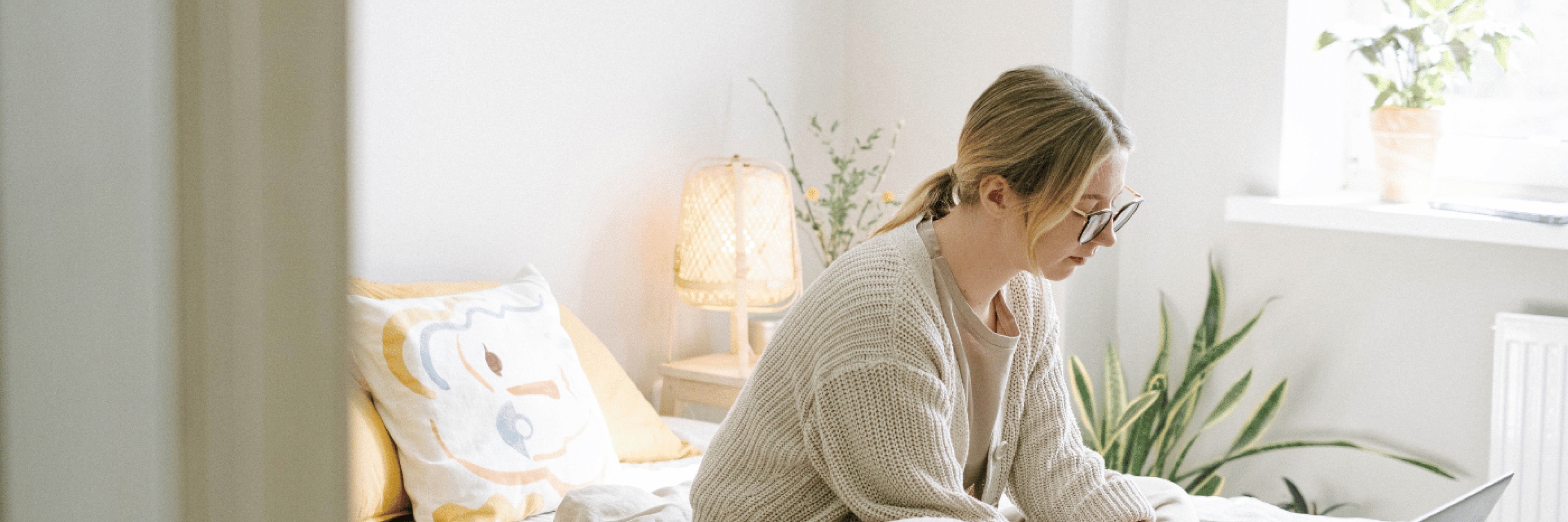 Woman working on bed